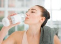 Life is simple, just take it with a sip of water. a young woman drinking water while working out. Royalty Free Stock Photo