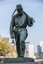 Life-size bronze monument of a mine worker