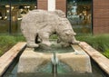 Life-size cast-stone animal figure titled `The Bear` by Mogens Boggild outside the World Trade Center in Dallas, Texas.