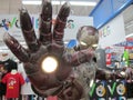 A life size Marvel hero Iron Man figure striking a pose at a departmental store mart