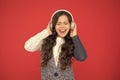 Life is song, sing it. Happy child sing song red background. Little girl listen to song in headphones. Modern life. New