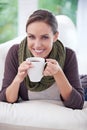 Life starts after coffee. Portrait of a beautiful woman relaxing at home with a cup of coffee.