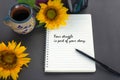 Life story inspirational quote - Your struggle is part of your story. Text on notebook with pen, coffee cup and sunflower.