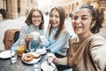 Three young women taking selfie picture drinking coffee sitting at bar cafeteria Royalty Free Stock Photo