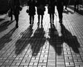 Silhouettes of people walking the streets of a big city Royalty Free Stock Photo