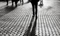 Silhouettes of people walking the streets of a big city Royalty Free Stock Photo