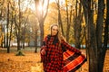 Life Style Portrait of Happy Woman in fall park. Beautiful girl on the nature picnic camping. Relaxing Girl in autumn Nature.