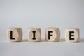 Life symbol. Concept word Life on wooden cubes. Beautiful white background. Business and Life concept. Copy space Royalty Free Stock Photo