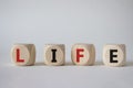 Life symbol. Concept word Life on wooden cubes. Beautiful white background. Business and Life concept. Copy space Royalty Free Stock Photo