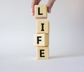 Life symbol. Concept word Life on wooden cubes. Businessman hand. Beautiful white background. Business and Life concept. Copy Royalty Free Stock Photo