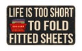 Life is too short to fold fitted sheets vintage rusty metal sign Royalty Free Stock Photo