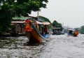 Tourists on longtailed river boats Royalty Free Stock Photo