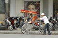 Hanoi, Vietnam, : Life in vietnam- Cyclo beside Sword lake in hanoi, vietnam. Cyclo is the tourist`s farvourite vehicle Royalty Free Stock Photo