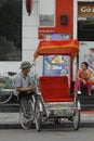 Hanoi, Vietnam, : Life in vietnam- Cyclo beside Sword lake in hanoi, vietnam. Cyclo is the tourist`s farvourite vehicle Royalty Free Stock Photo