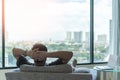 Life-work balance and city living lifestyle concept of business man relaxing, take it easy in home office or hotel room resting Royalty Free Stock Photo