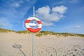 Lifebelt at beach and sand dunes near Blavand, Jutland Denmark