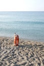 A lifebelt on an empty beach on Italian coast with copy space for your text