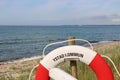 Lifebelt in front of the Baltic Sea. Royalty Free Stock Photo