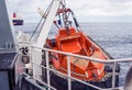 Lifeboat or FRC rescue boat in the vessel at sea. Tanker ship is on background Royalty Free Stock Photo