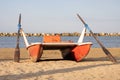 Classic italian rescue ship or rescue rowing catamaran on the sand on beach on the sunset. Royalty Free Stock Photo