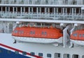 Lifeboats hanging over deck on cruise ship Royalty Free Stock Photo