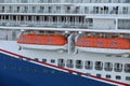 Lifeboats hanging over deck on cruise ship Royalty Free Stock Photo