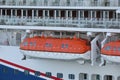 Lifeboats hanging over deck on cruise ship Royalty Free Stock Photo