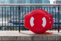 Lifebuoy attached to metal railing