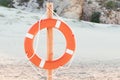lifebuoy on the beach at resort. Concept of vacation and safety when swimming in the sea Royalty Free Stock Photo