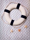 Lifebuoy on a blue grid over white background Royalty Free Stock Photo