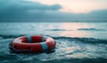 A lifebuoy in blue ocean waters. Insurance and guarantee conditions. Royalty Free Stock Photo