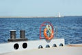 Lifebuoy and bollard on pier Royalty Free Stock Photo