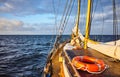 Lifebuoy on the deck of an old sailing schooner at sunset Royalty Free Stock Photo