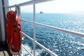 Lifebuoy hanged on the side bars of the boat