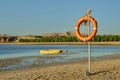 Lifebuoy hanging on a pole. Royalty Free Stock Photo