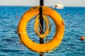 Lifebuoy hanging on a pole on the Red Sea Royalty Free Stock Photo