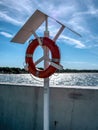 A lifebuoy hanging by the seashore