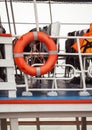 Lifebuoy and life jackets on a ferry deck close-up. Rescue equipment Royalty Free Stock Photo