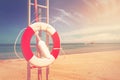 Lifebuoy, Life Preserver on Sandy Beach Royalty Free Stock Photo