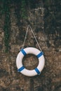 Lifebuoy, life saving ring on stone wall Royalty Free Stock Photo