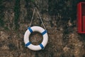Lifebuoy, life saving ring on stone wall Royalty Free Stock Photo