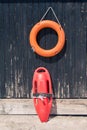 Lifebuoy and lifeguard rescue can equipment against the wooden t Royalty Free Stock Photo