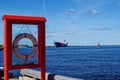 Lifebuoy, lifesaver ring captured against a ship n the sea port in Ventspils, Latvia