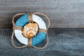 Lifebuoy on old grey wooden background in sea style with wood, d Royalty Free Stock Photo