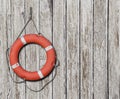 Lifebuoy on old wood white background Royalty Free Stock Photo