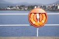 Lifebuoy orange water safety ring at Helensburgh beach Royalty Free Stock Photo