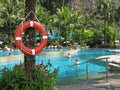 Lifebuoy. People. Hotel. Outdoor pool in tropics.