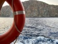 Lifebuoy on the railing of ship and Mediterranean sea Royalty Free Stock Photo