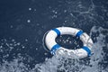 Lifebuoy safety equipment on waves in sea storm