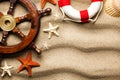 Lifebuoy, ship`s steering wheel, various shell and starfish